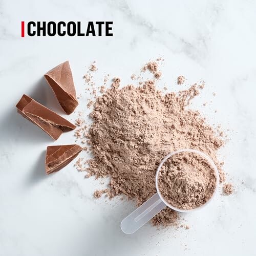 Chocolate powder with chunks on a marble surface.